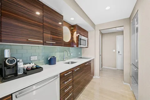 a kitchen with a sink and cabinets