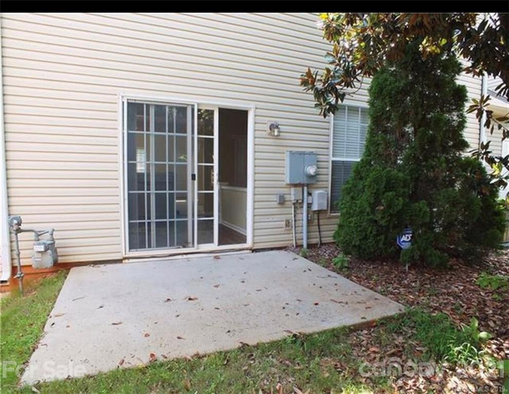 15413 Abbots Bridge Road Charlotte, NC 28277 - Photo 2 of 2 a front view of a house with a garden