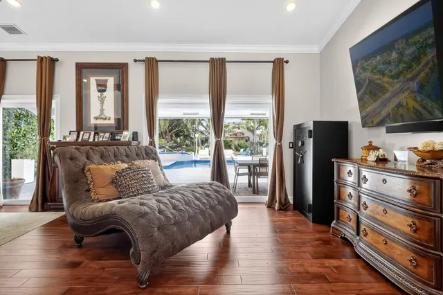 a view of a dining room with furniture and chandelier