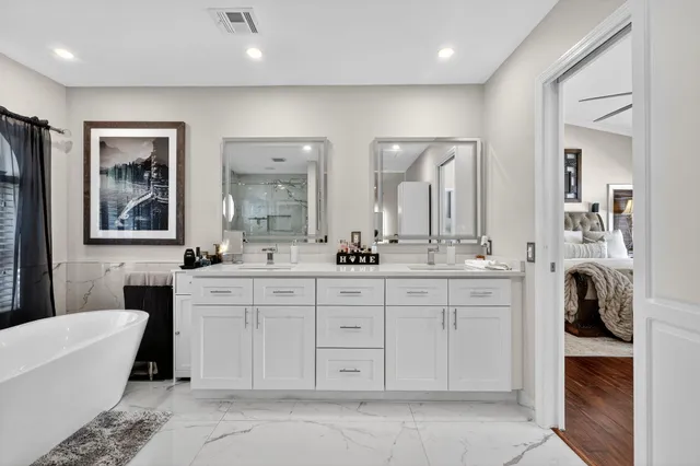 a dining room with furniture and a chandelier