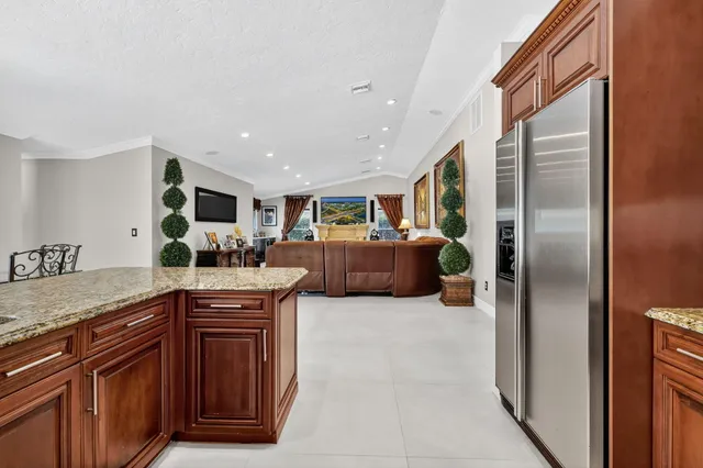 a living room with furniture a window and gym equipment
