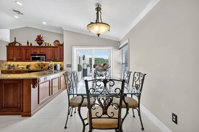 a living room with a fireplace and a large window