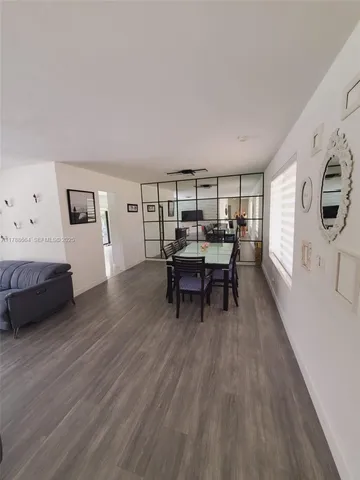 a view of a livingroom with furniture and wooden floor