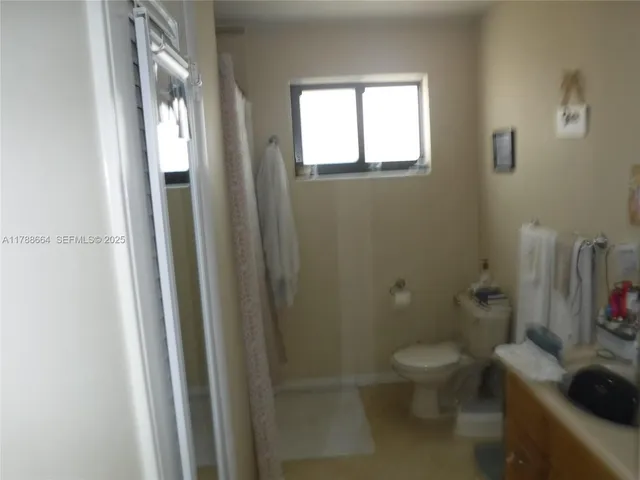 a bathroom with a toilet and a sink