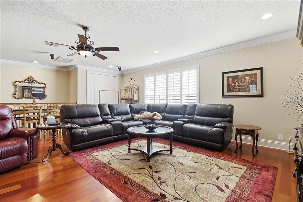 1416 North Ridge Meadow Path Hernando, FL 34442 - Photo 41 of 68 a living room with furniture and wooden floor