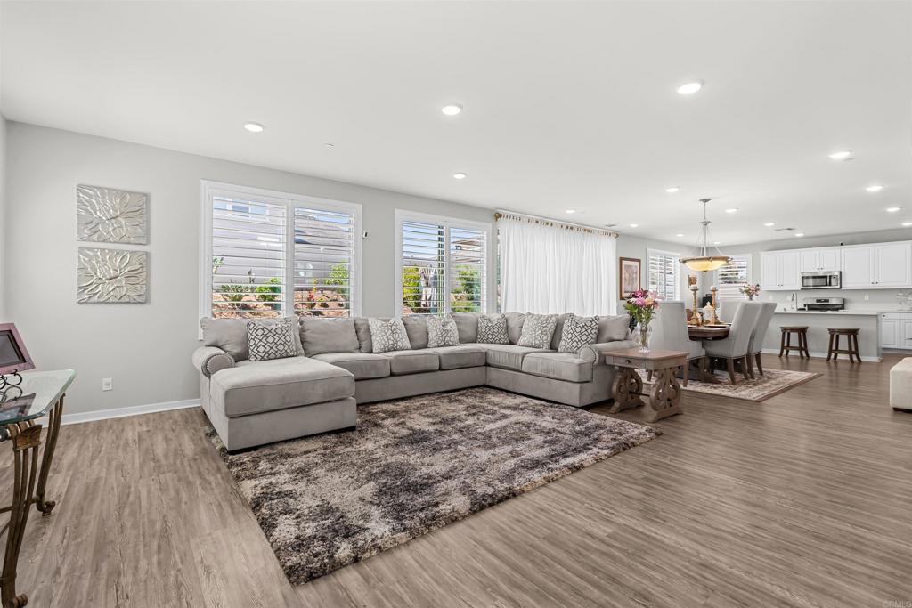 29809 Gypsy Vanner Way Menifee, CA 92584 - Photo 8 of 45 a living room with furniture wooden floor and windows