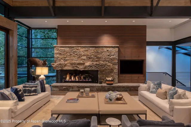a view of a hallway with wooden floor and door