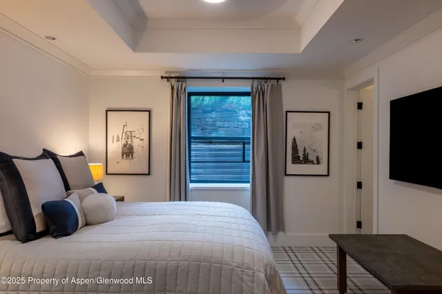 a bathroom with a granite countertop sink toilet a mirror and shower