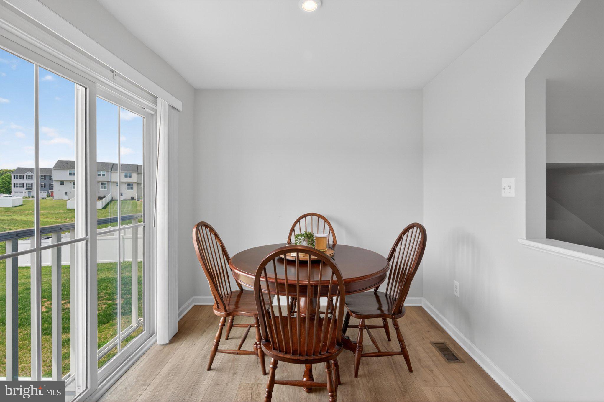 84 Tadpole Landing Road Inwood, WV 25428 - Photo 12 of 30 Bright dining nook with scenic views.