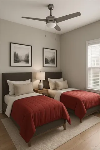 a bedroom with two beds and painting on the wall