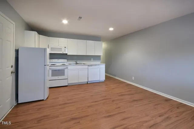 a view of kitchen with wooden floor