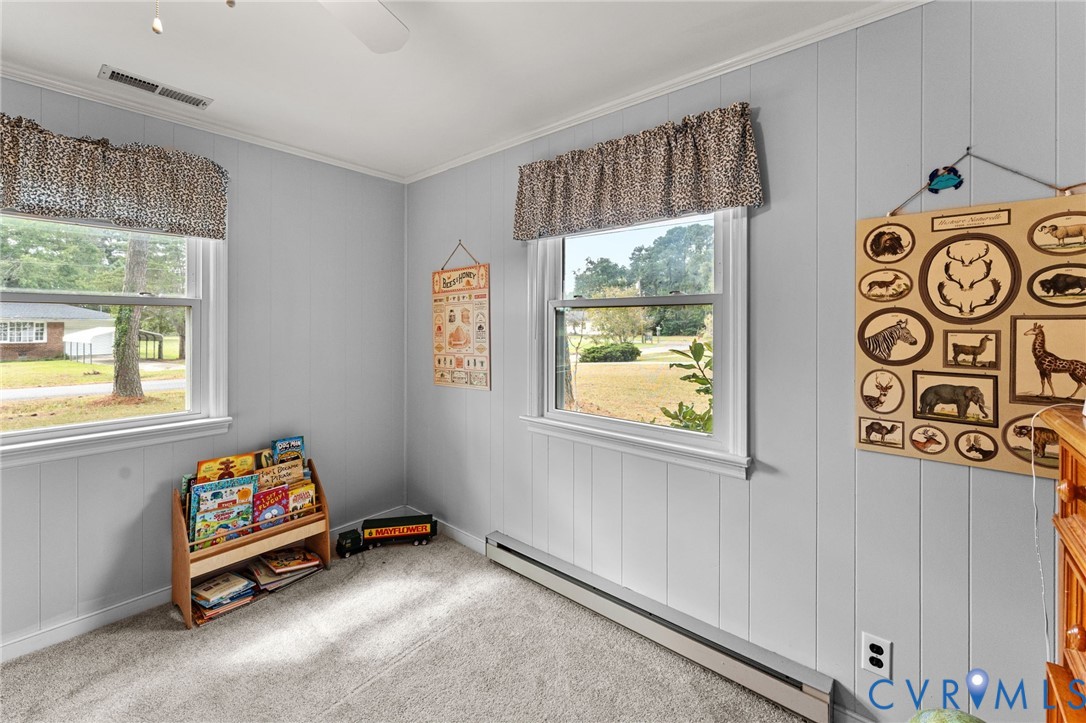 1061 Timberneck Road Deltaville, VA 23043 - Photo 15 of 28 a bench sitting in a room next to a window