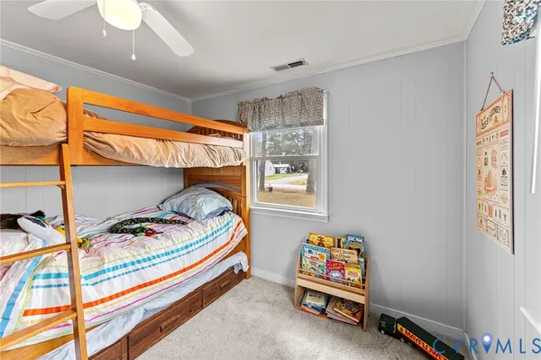 a bedroom with bed and a window