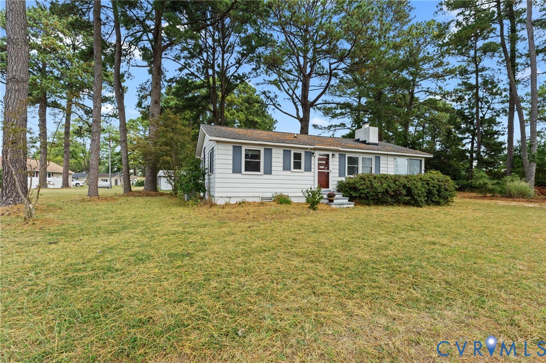 1061 Timberneck Road Deltaville, VA 23043 - Photo 21 of 28 a house view with a garden space