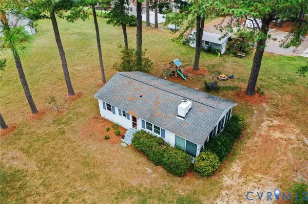 a aerial view of a house with outdoor space