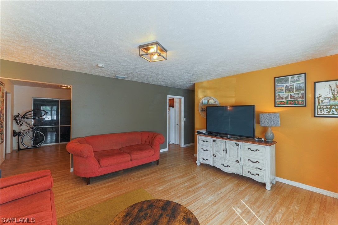 2914 Sunset Road Fort Myers, FL 33901 - Photo 6 of 28 a living room with furniture and a flat screen tv