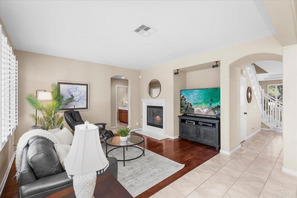 838 Luminara Way San Marcos, CA 92078 - Photo 23 of 54 a living room with furniture and a fireplace