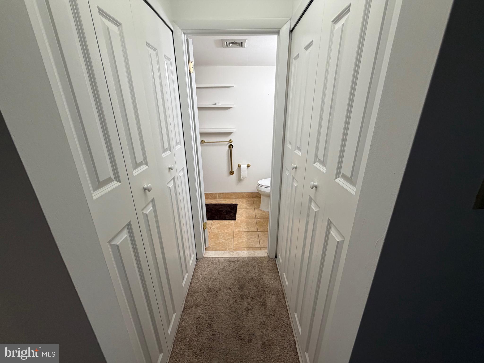106 Pinewood Drive Hamilton, NJ 08690 - Photo 6 of 12 a view of a bathroom from a hallway