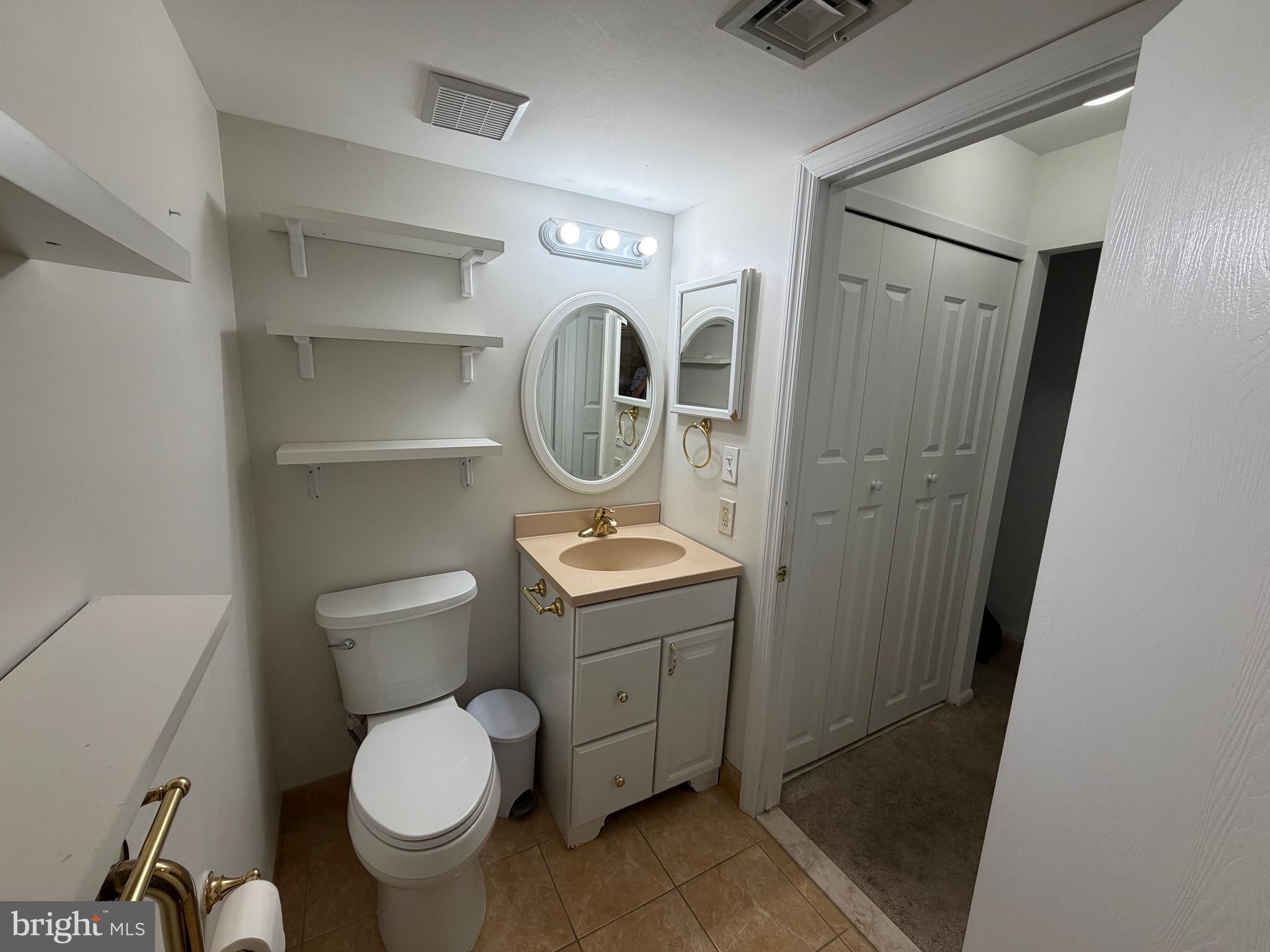 106 Pinewood Drive Hamilton, NJ 08690 - Photo 8 of 12 a bathroom with a toilet and a sink