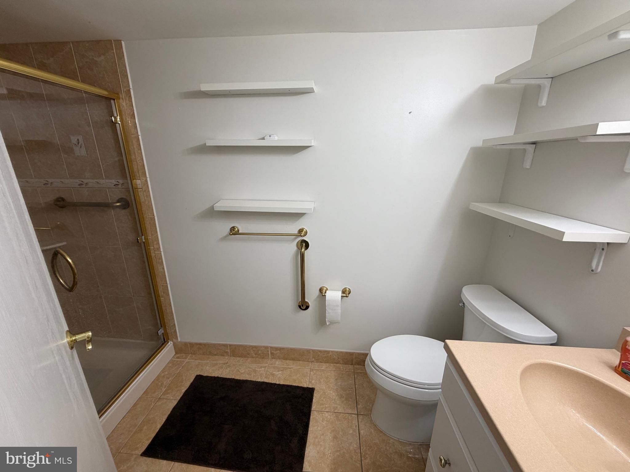 106 Pinewood Drive Hamilton, NJ 08690 - Photo 9 of 12 a bathroom with a toilet and a shower