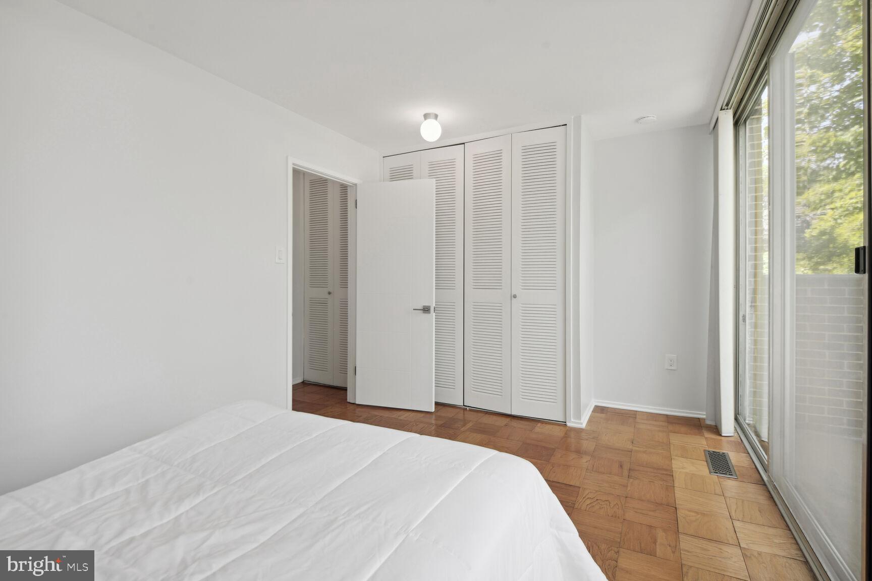 345 O Street Southwest Washington, DC 20024 - Photo 16 of 46 a view of a bedroom with wooden floor and windows