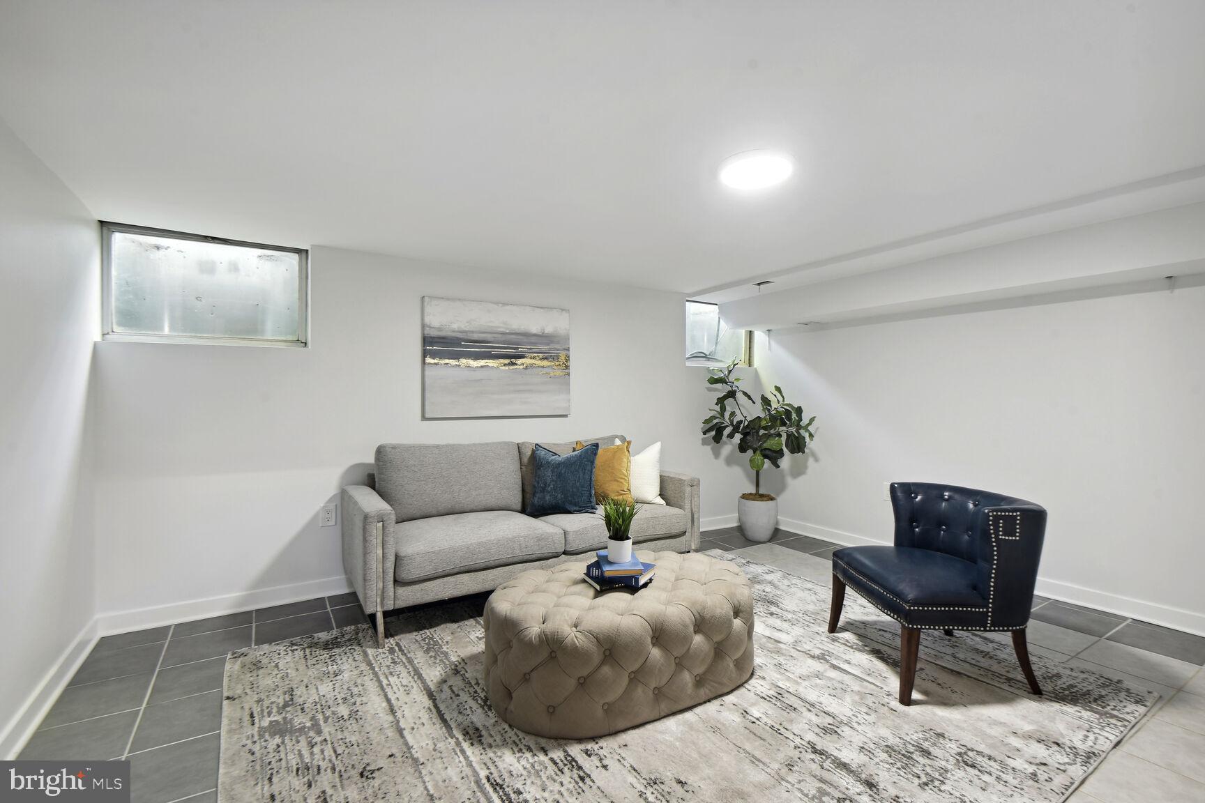 345 O Street Southwest Washington, DC 20024 - Photo 19 of 46 a living room with furniture and a potted plant