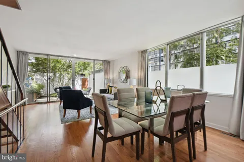 a view of a dining room with furniture window and wooden floor