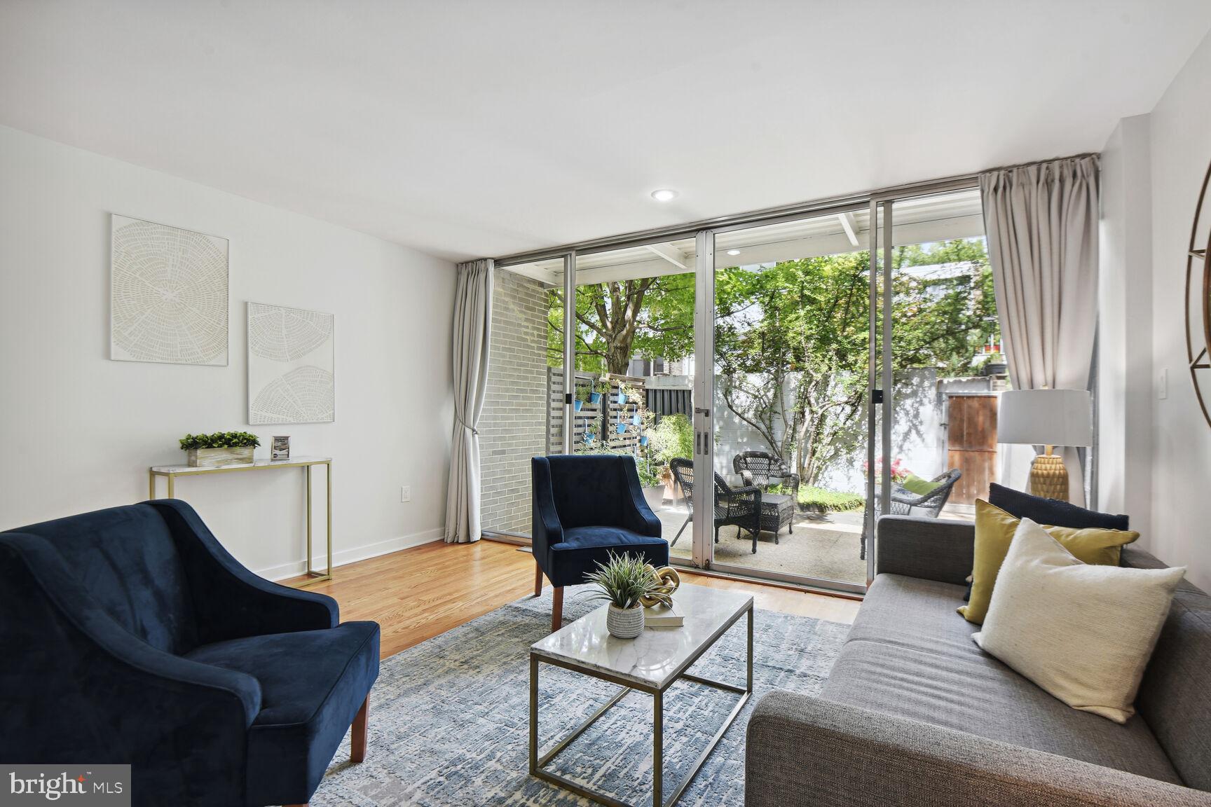 345 O Street Southwest Washington, DC 20024 - Photo 4 of 46 a living room with furniture and a flat screen tv