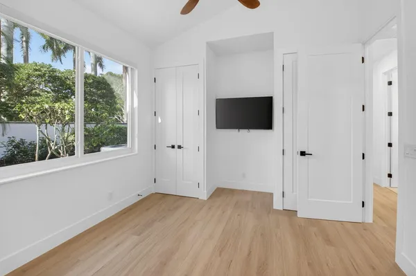 a view of an empty room with a large window