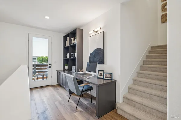 a workspace with furniture and wooden floor