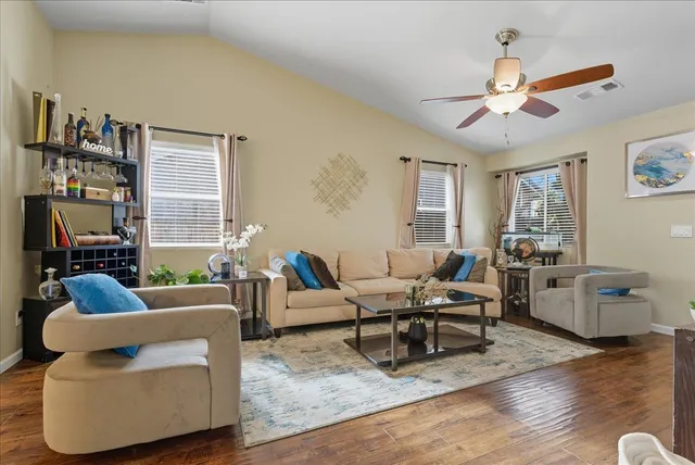 a living room with furniture and a window