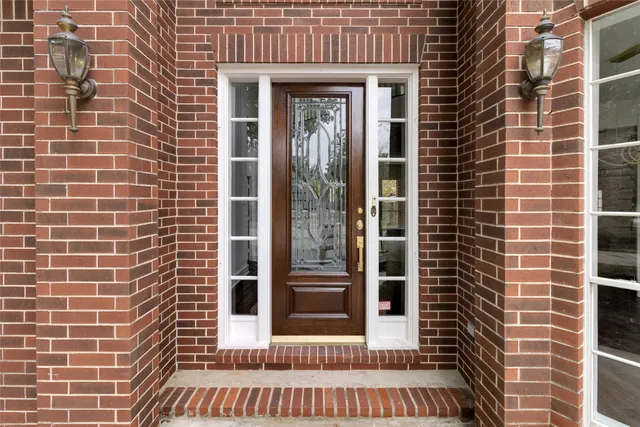 a view of an entryway with wooden floor