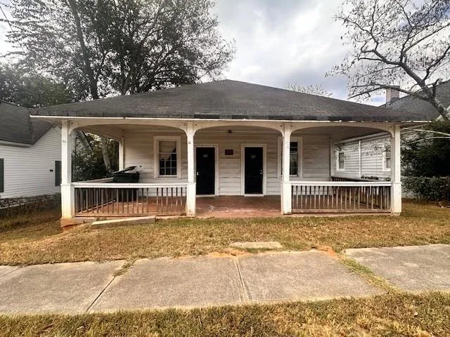 front view of a house with a large window