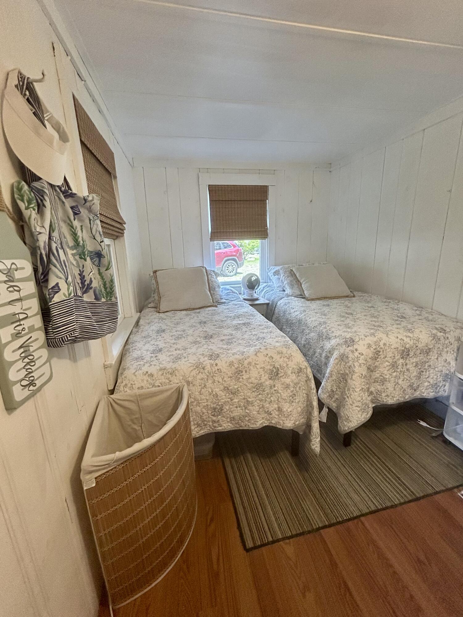 262 Old Wharf Road, Unit U67 Dennis Port, MA 02639 - Photo 14 of 54 a bedroom with two beds and a dresser