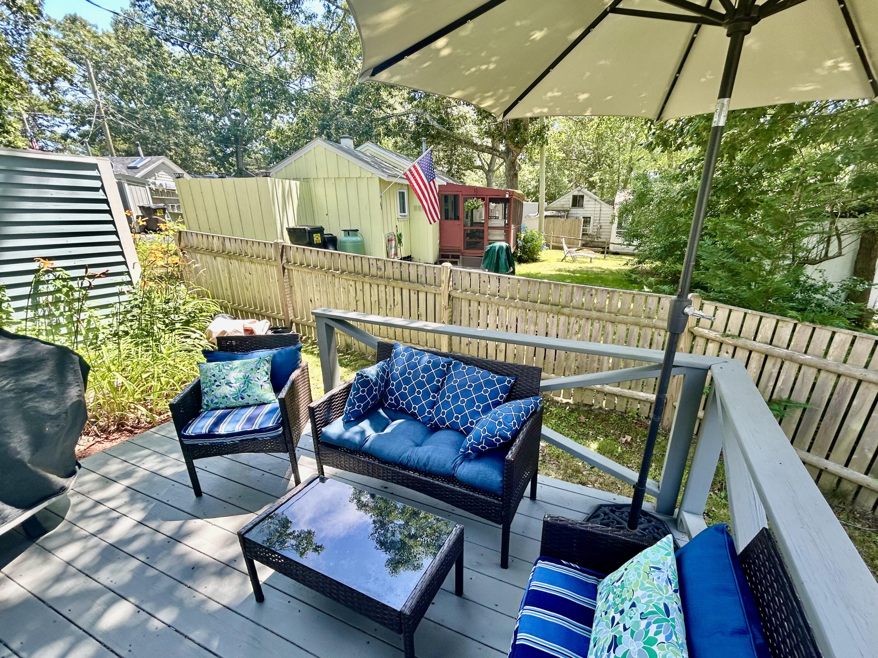 262 Old Wharf Road, Unit U67 Dennis Port, MA 02639 - Photo 40 of 54 a view of a chairs and table in the patio