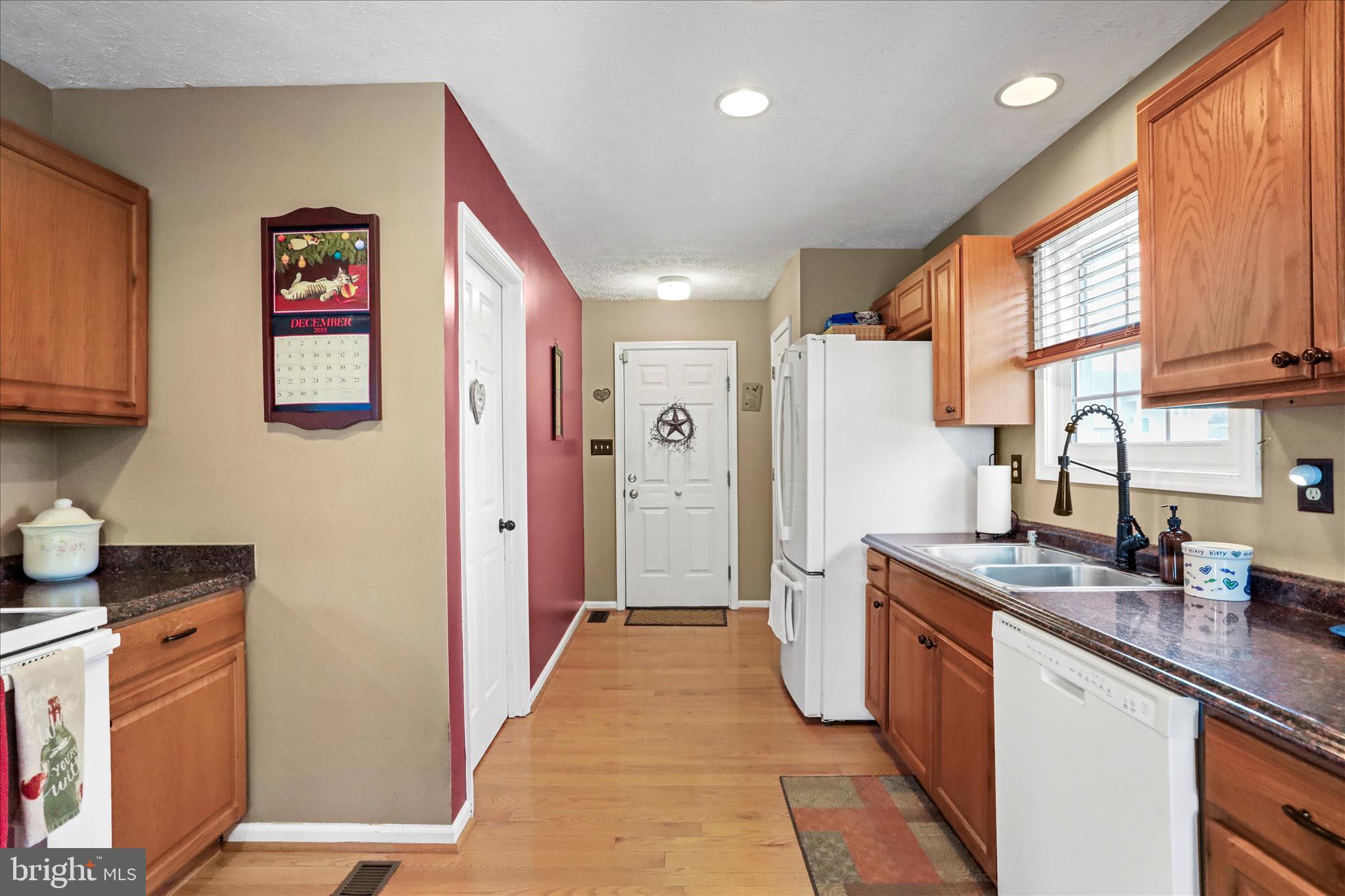 107 Briar Run Drive Ranson, WV 25438 - Photo 12 of 45 a kitchen with a refrigerator and a sink
