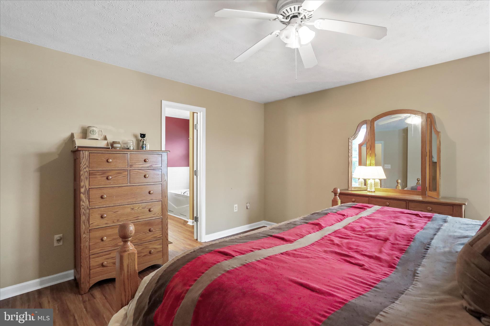 107 Briar Run Drive Ranson, WV 25438 - Photo 21 of 45 a bedroom with a bed and a dresser