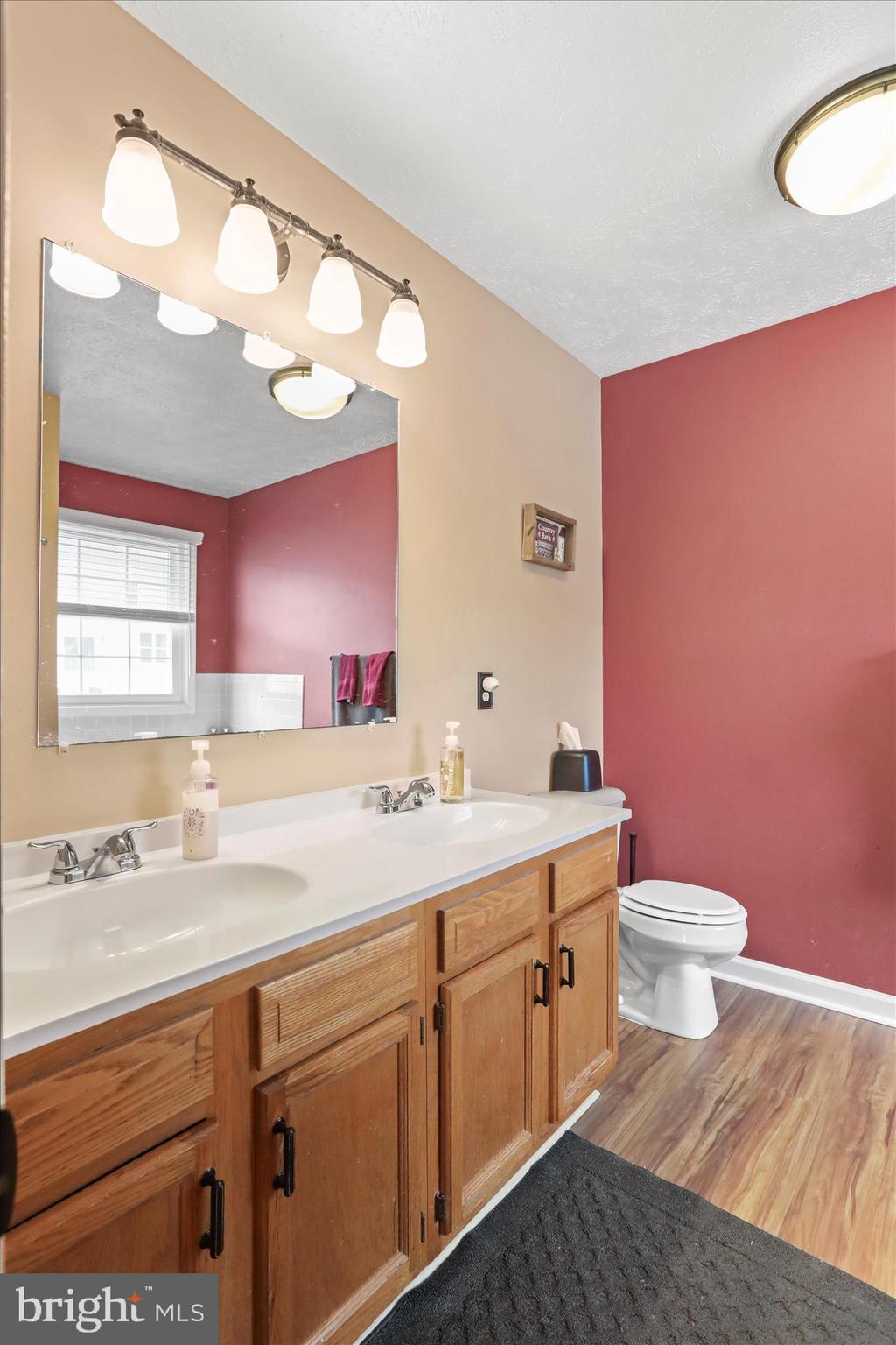 107 Briar Run Drive Ranson, WV 25438 - Photo 22 of 45 a bathroom with a sink a toilet and a mirror