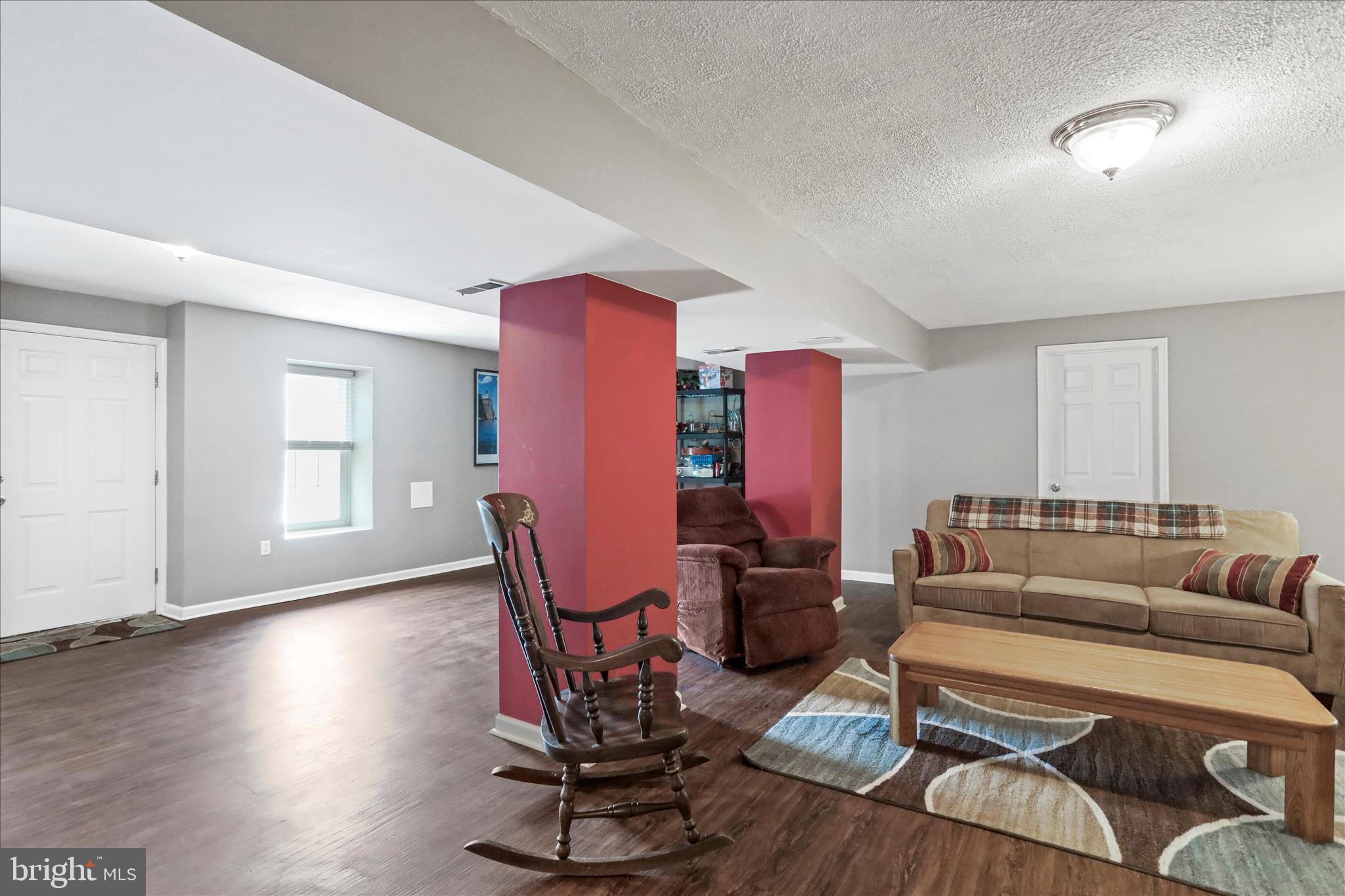 107 Briar Run Drive Ranson, WV 25438 - Photo 26 of 45 a living room with furniture a wooden floor and next to a window