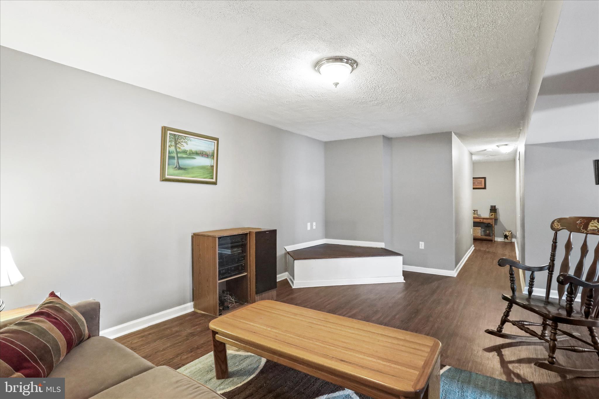 107 Briar Run Drive Ranson, WV 25438 - Photo 27 of 45 a living room with furniture and a wooden floor