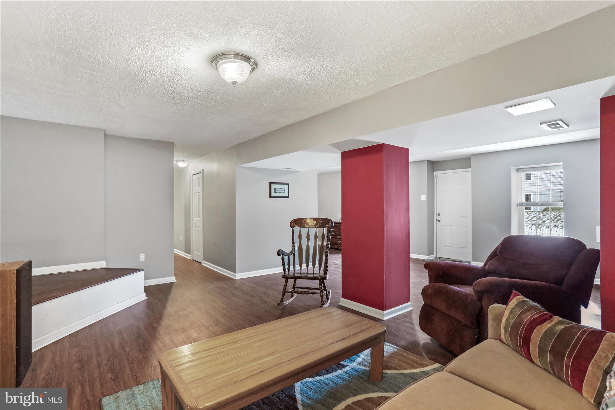 107 Briar Run Drive Ranson, WV 25438 - Photo 28 of 45 a living room with furniture rug and wooden floor