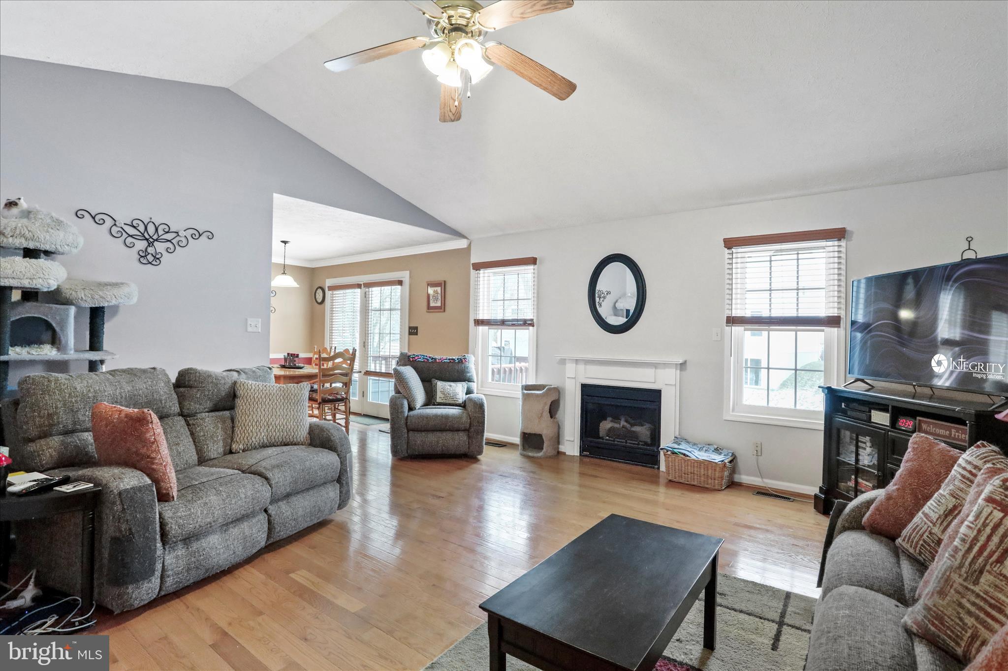 107 Briar Run Drive Ranson, WV 25438 - Photo 7 of 45 a living room with furniture a fireplace a rug and a window
