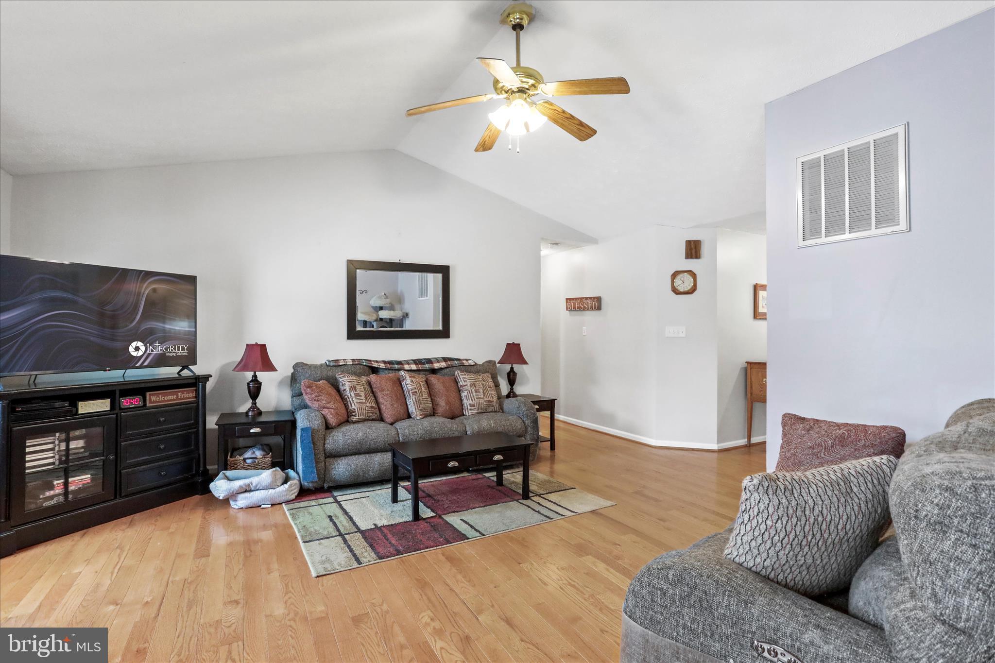 107 Briar Run Drive Ranson, WV 25438 - Photo 8 of 45 a living room with furniture and a flat screen tv