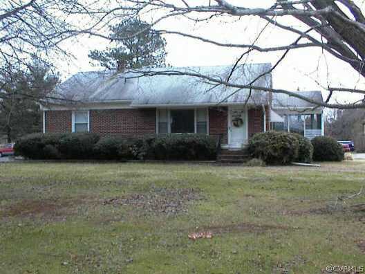 1852 Cumberland Road Farmville, VA 23901 - Photo 1 of 1 a front view of house with yard and trees around