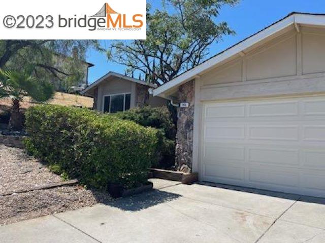 142 Encinal Place Pittsburg, CA 94565 - Photo 2 of 8 a couple of potted plants in front of door