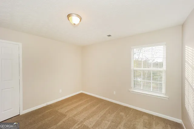 a view of a room with windows