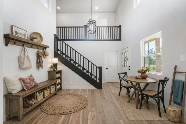 a kitchen with stainless steel appliances granite countertop a sink and dishwasher a stove top oven with wooden floor