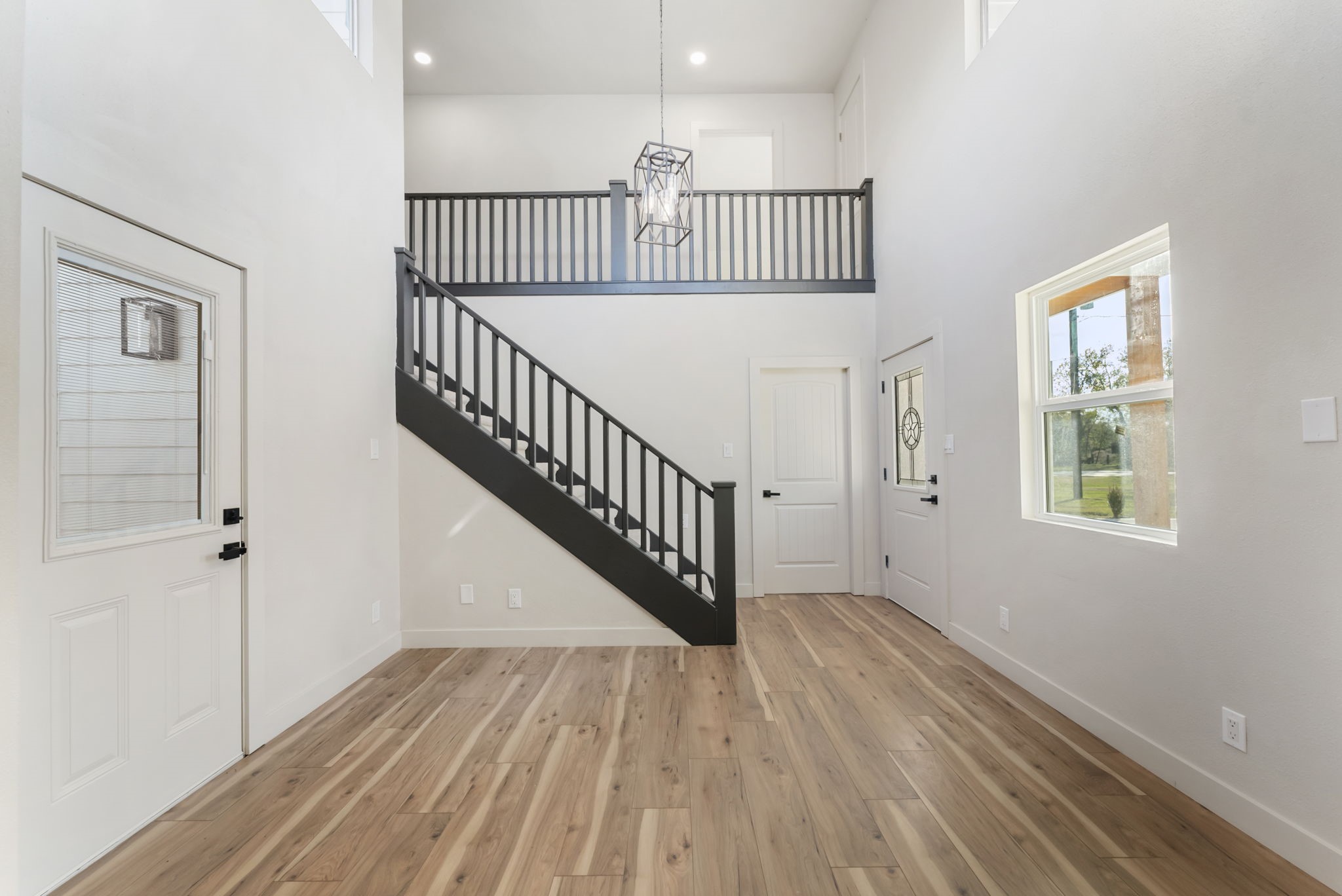 24521 Magnolia Road Hockley, TX 77447 - Photo 18 of 50 a view of staircase with wooden floor and white walls