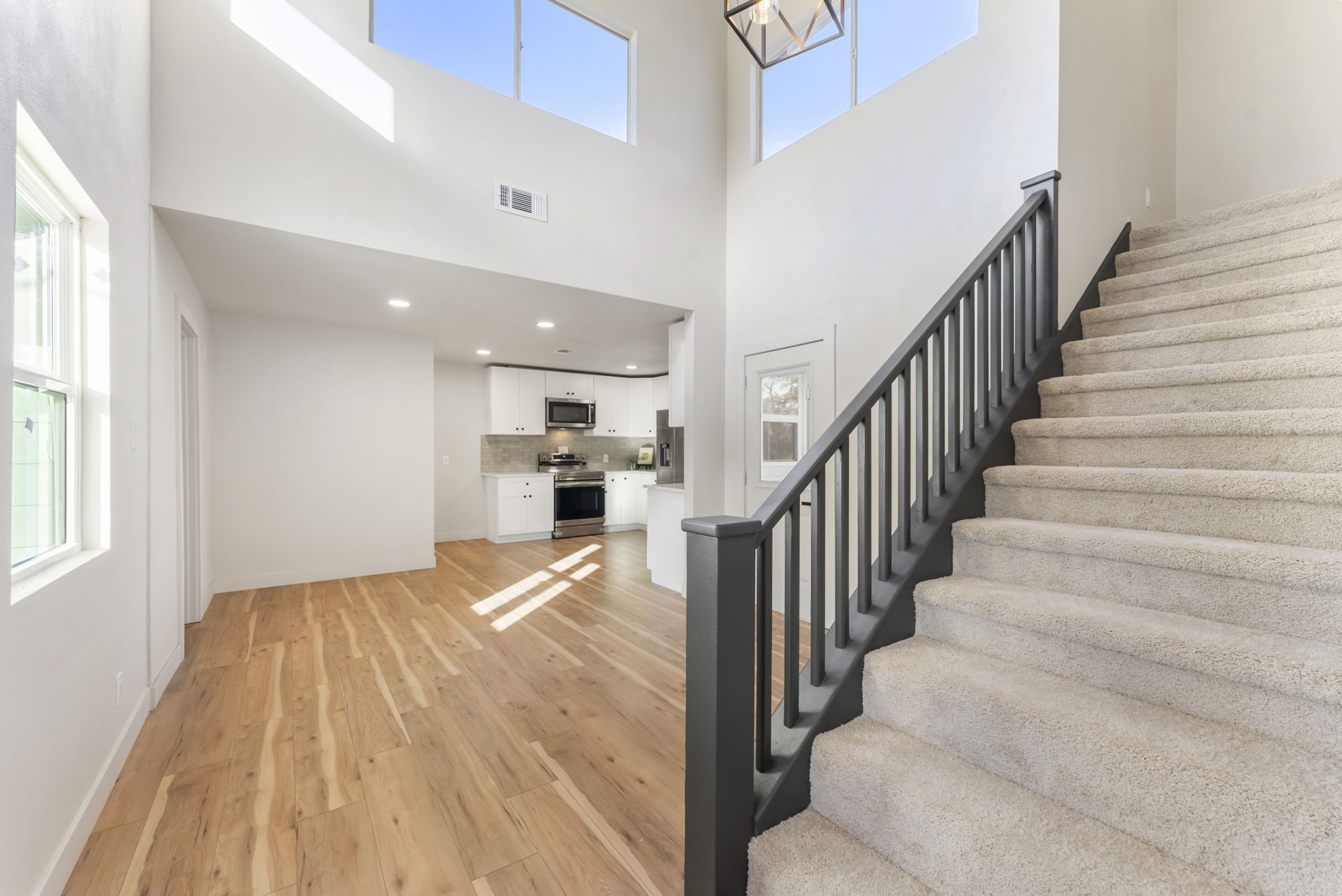 24521 Magnolia Road Hockley, TX 77447 - Photo 20 of 50 a view of staircase and kitchen with sink