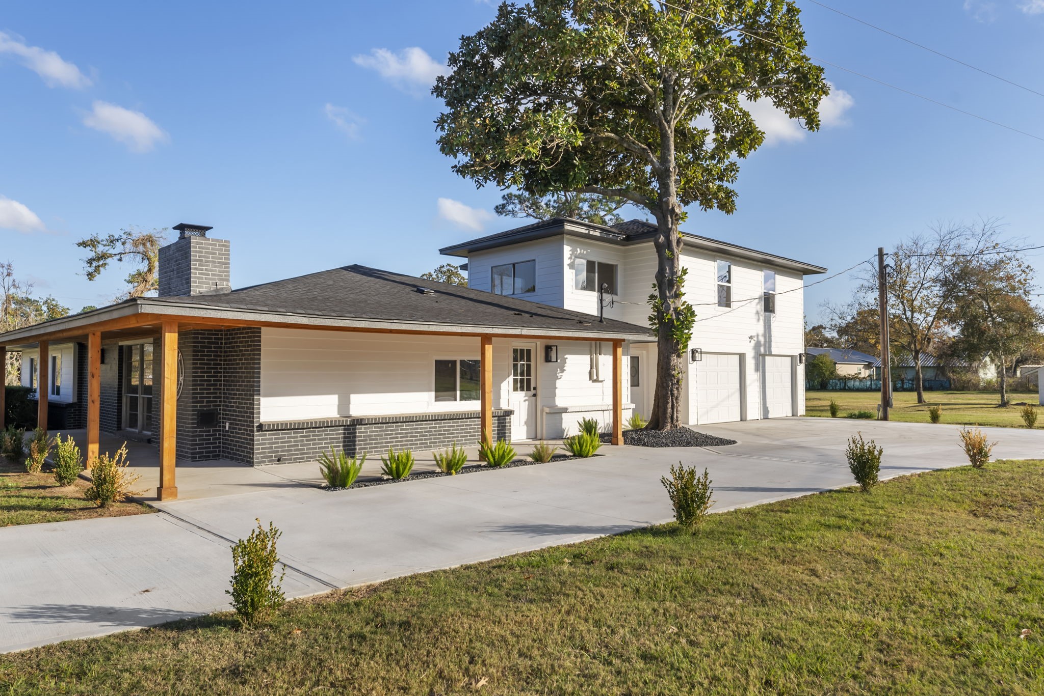 24521 Magnolia Road Hockley, TX 77447 - Photo 2 of 50 a front view of a house with a yard and garage